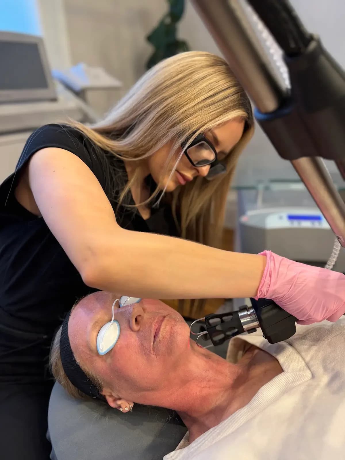 A Rella provider performing a device-based skin treatment